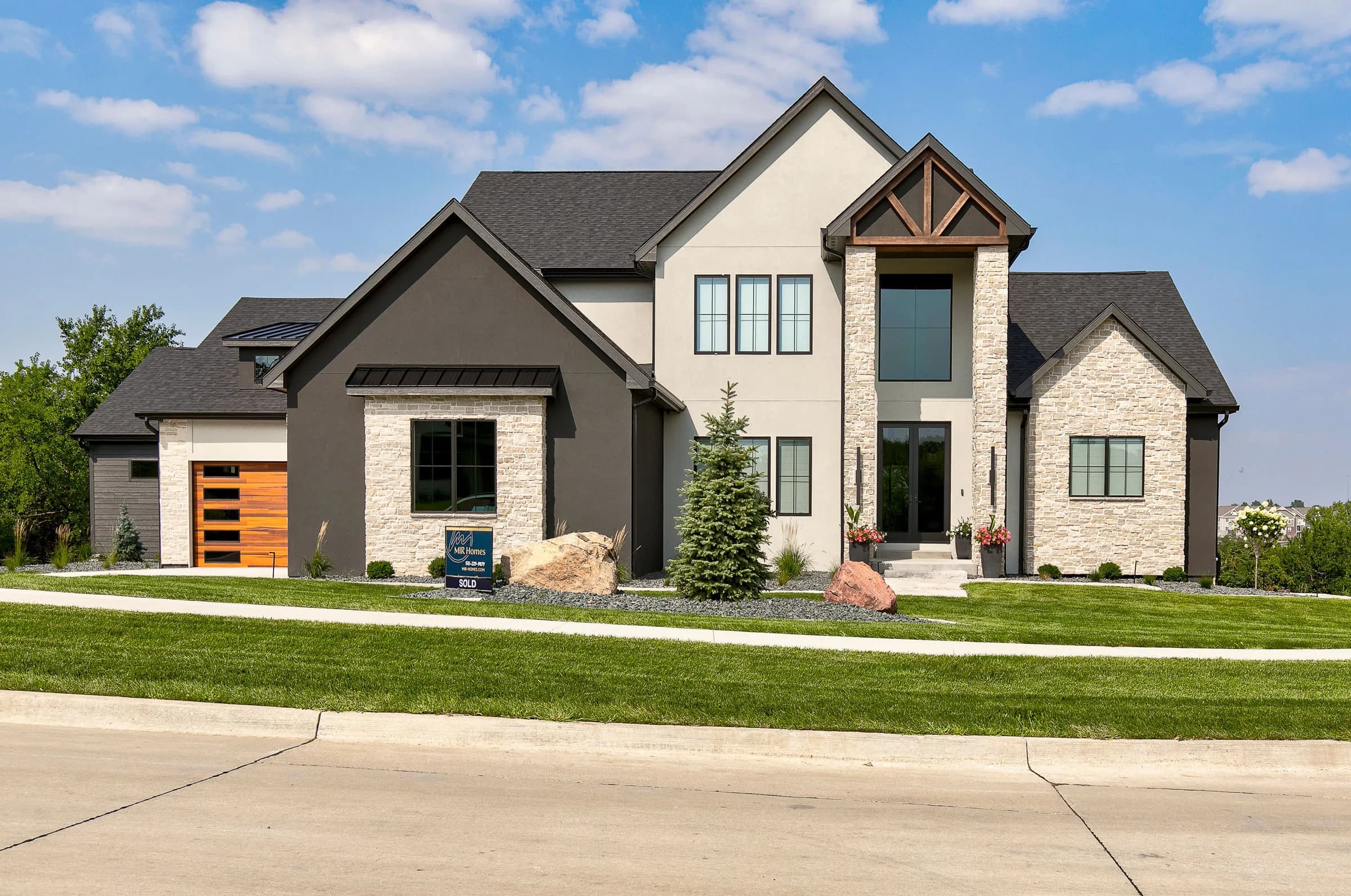 Forest Pointe — front exterior with stone and timber detail