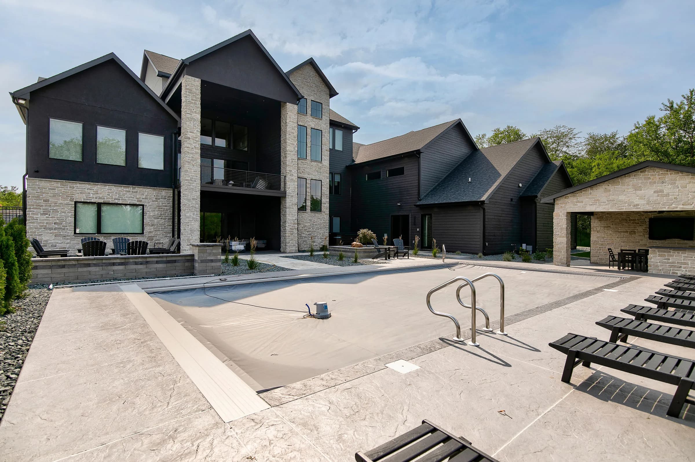Backyard pool and rear elevation of a MIR Homes custom build