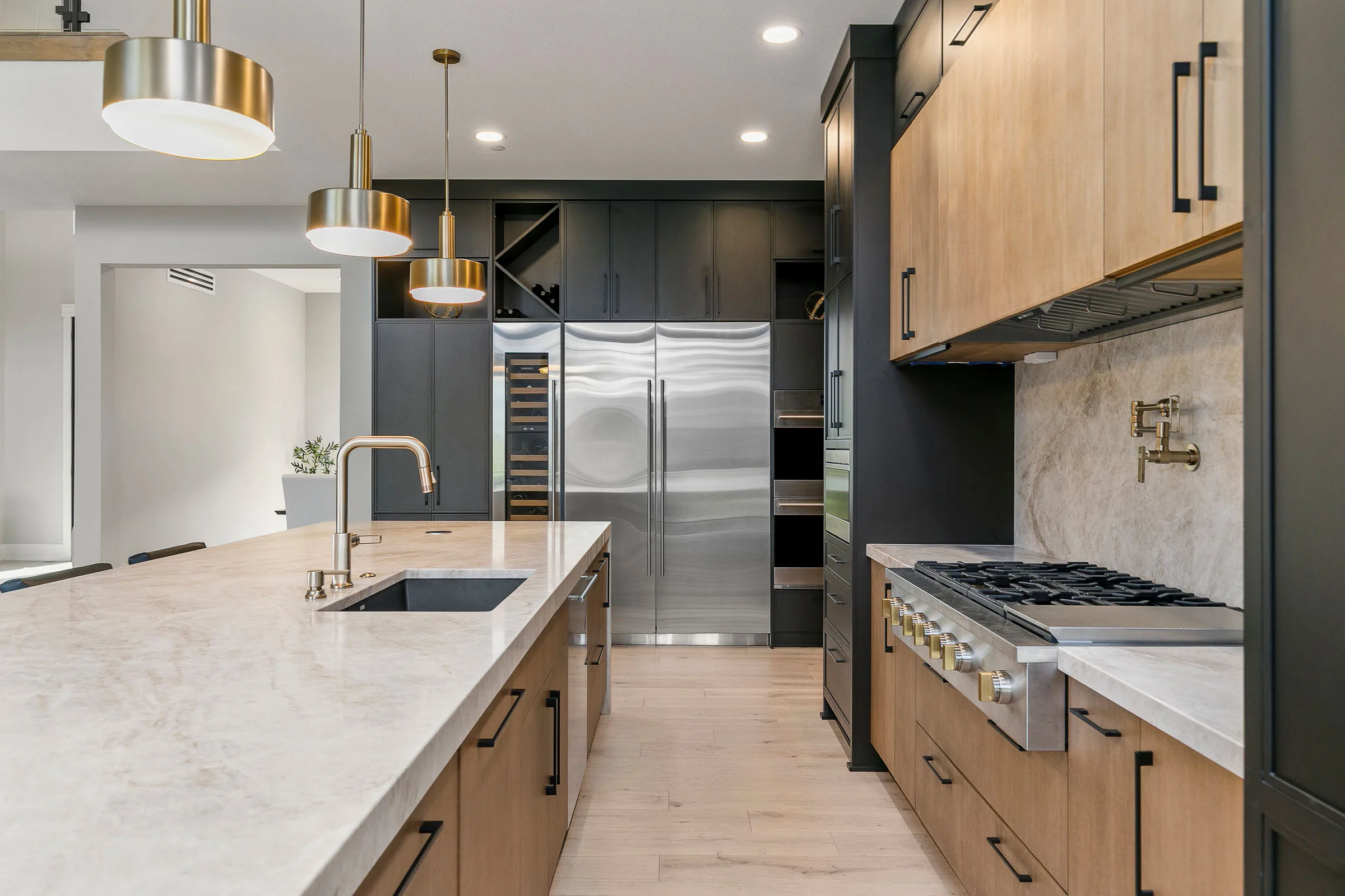Kitchen craftsmanship by MIR Homes — custom cabinetry and stone island